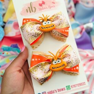 Orange and Gold Hair Bows with Cartoon Character